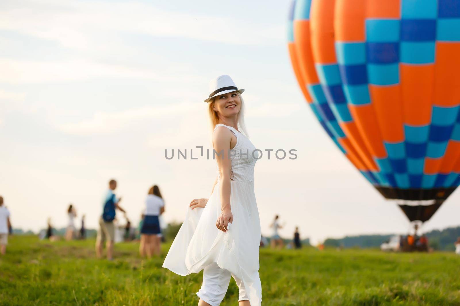 Amazing view with woman and air balloon. Artistic picture. Beauty world. The feeling of complete freedom