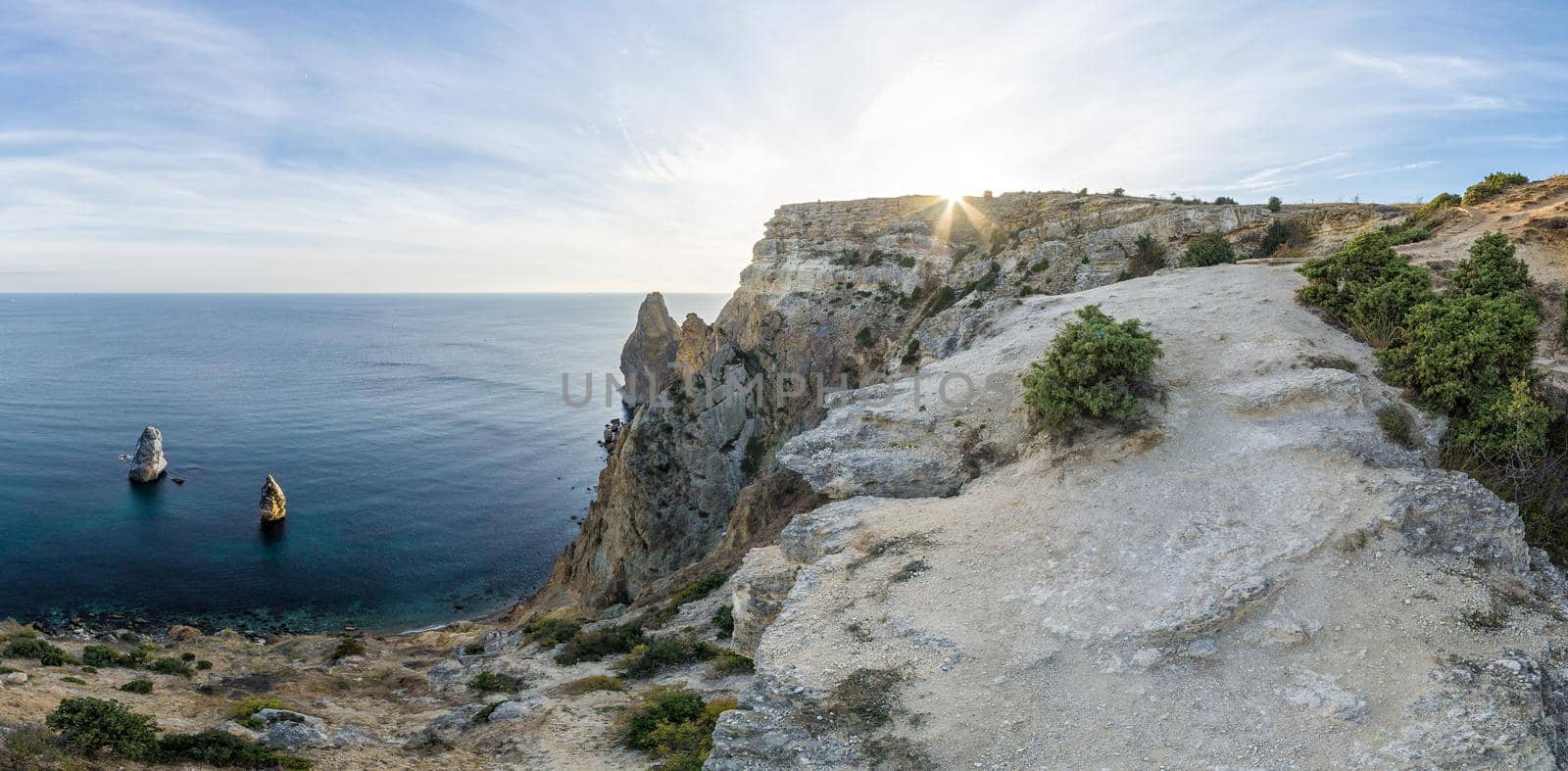 Summer seascape with Fiolent rocks formation on the coast of Sevastopol. view on cape in the sea, clear azure water, calm hot day. Copy space. The concept of calmness, silence and unity with nature. by panophotograph