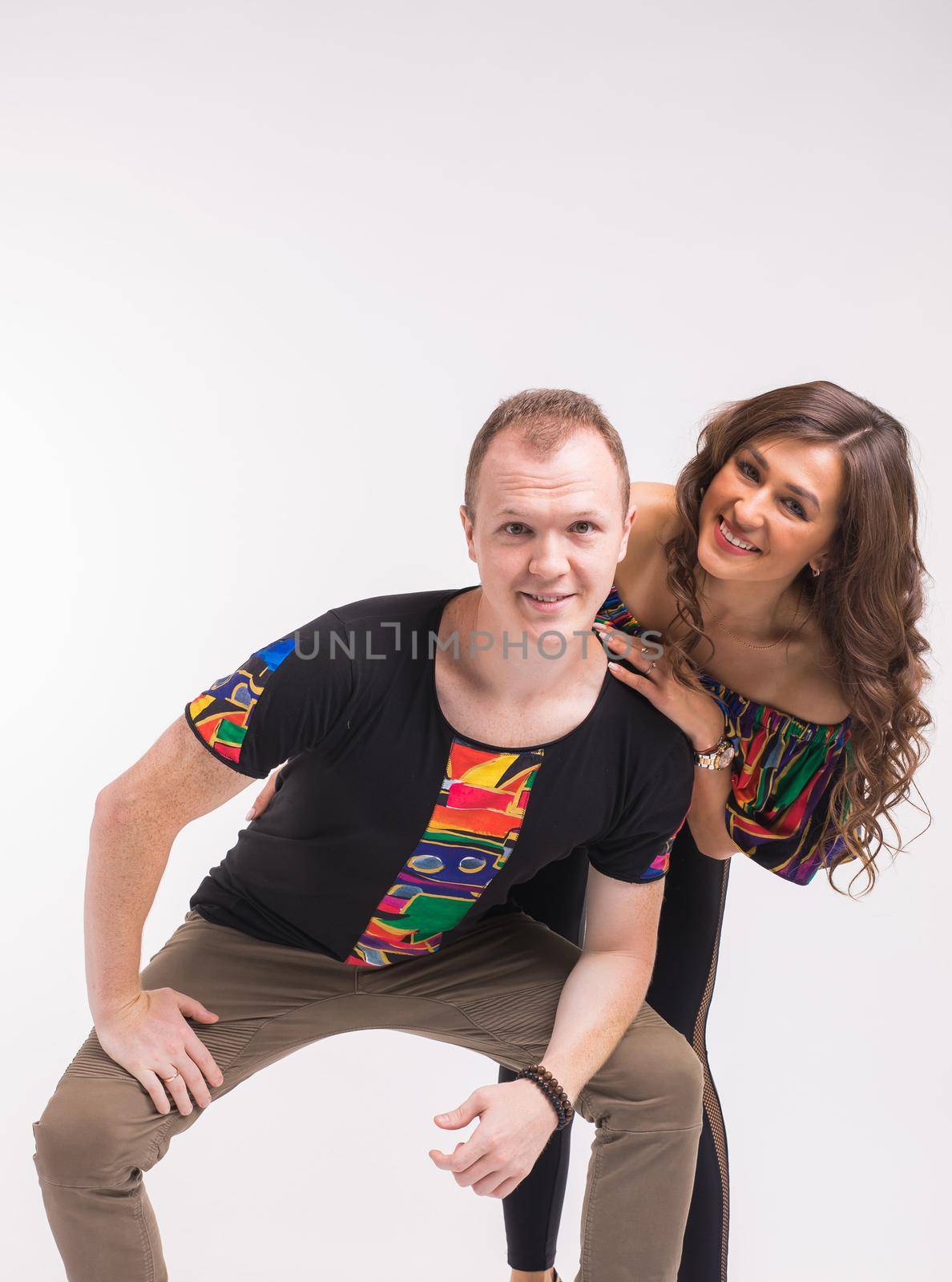 Funny couple dancing social dance. Kizomba or bachata or semba or taraxia , on white background. Social dance concept. by Satura86