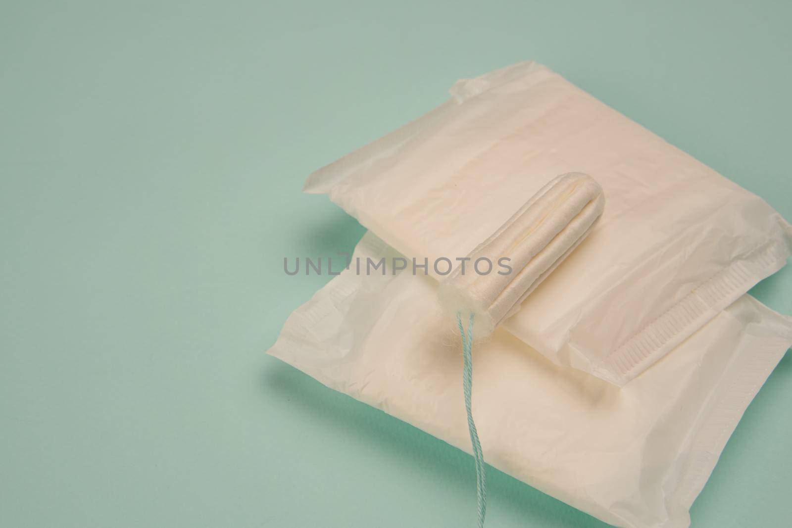 feminine pads underwear hygiene protection medicine blue background. High quality photo
