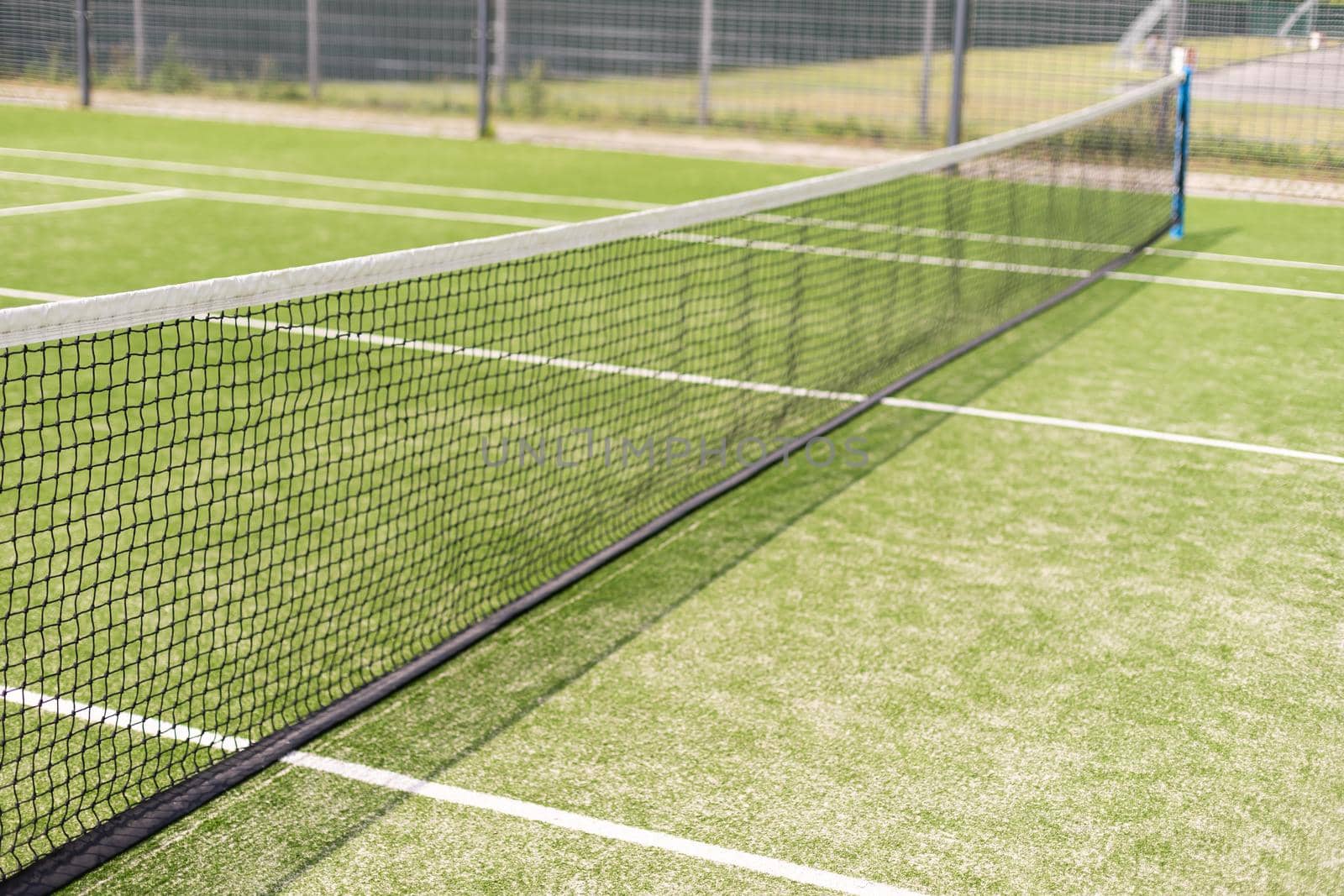 Tennis net and court. Playing Tennis. Healthy lifestyle