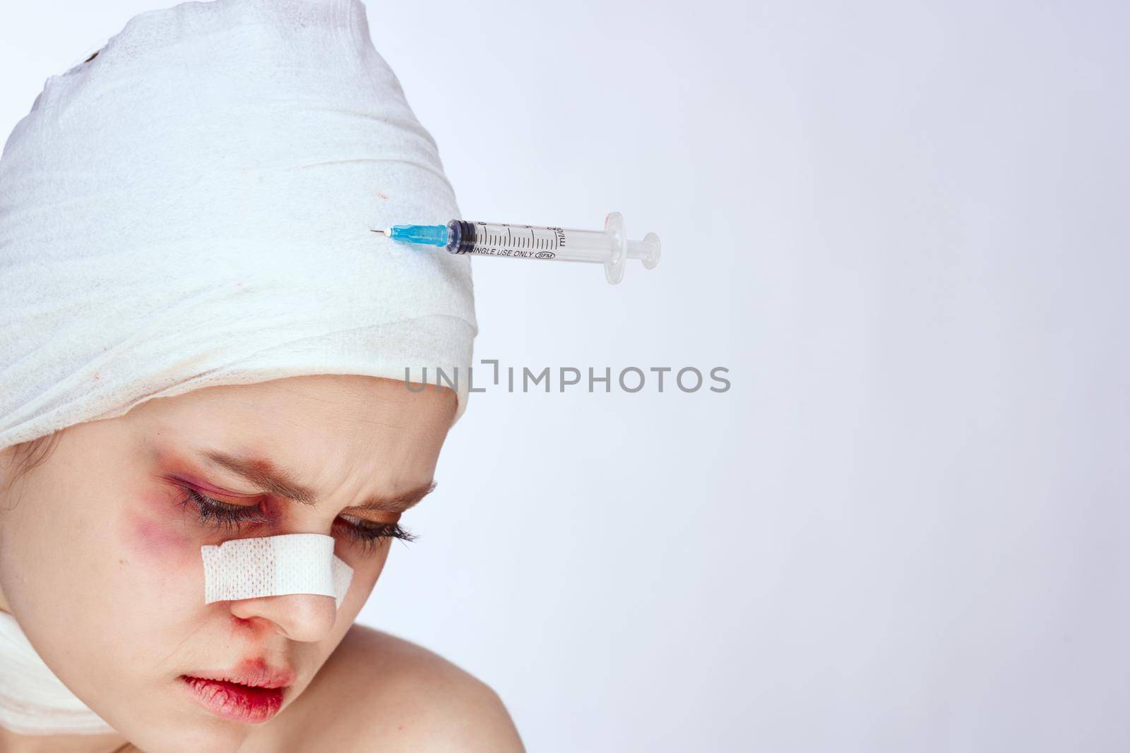 portrait of a woman health problem injury face injection light background. High quality photo