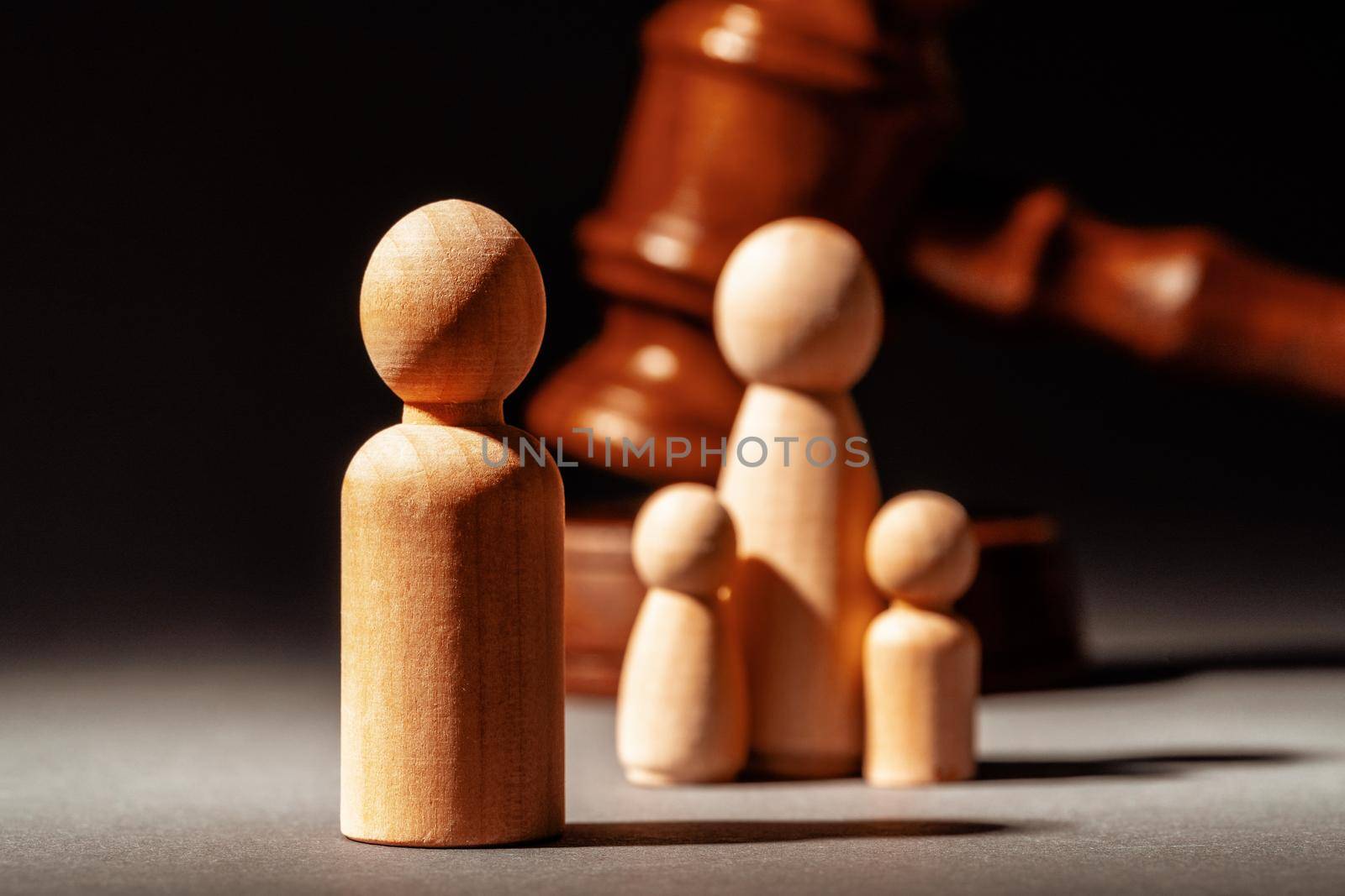Wooden toy family and judge mallet. Family divorce concept by Fabrikasimf