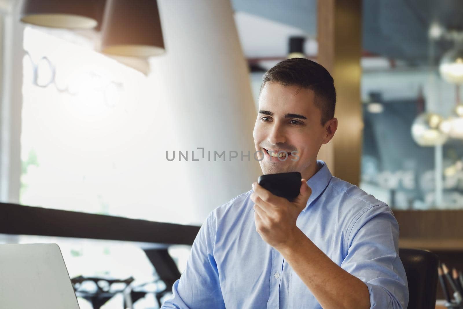 Male marketing manager using phone to talk to venture capital firm to increase profit potential. by Manastrong