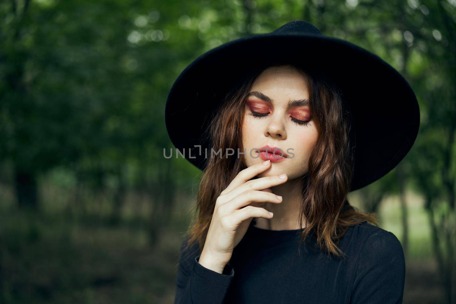 woman dressed as a witch in the forest Halloween fantasy ritual by Vichizh