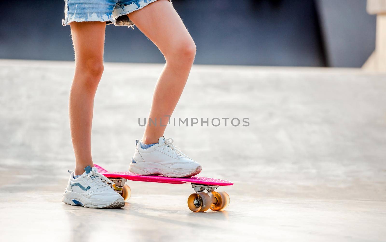 Girl with skateboard outdoors by tan4ikk1