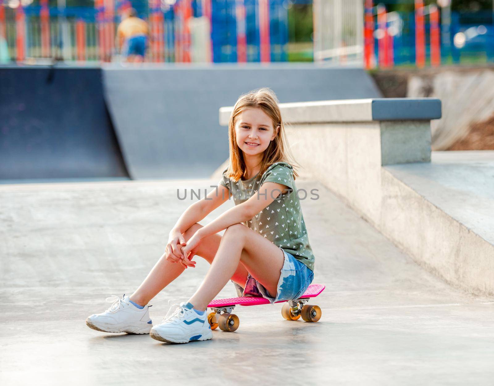 Girl with skateboard outdoors by tan4ikk1