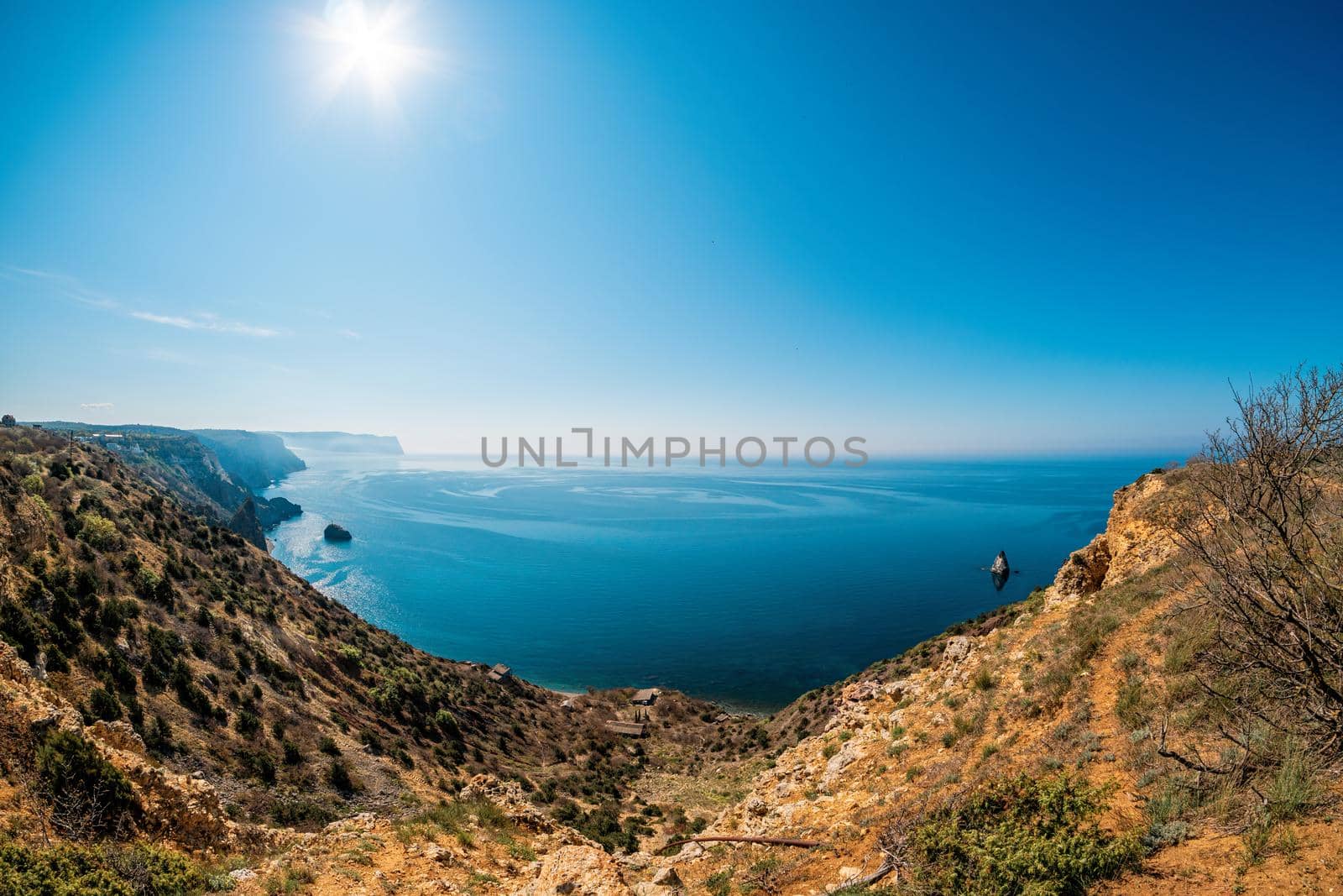 Panoramic seascape, calm azure sea and bright sun. Copy space. The concept of calmness, silence and unity with nature.