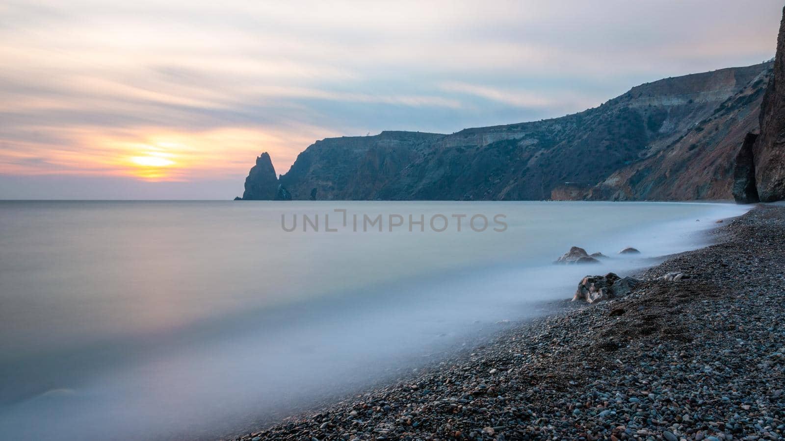 View of the sunset sea and the beach. Long exposure The concept of calmness, silence and unity with nature by panophotograph