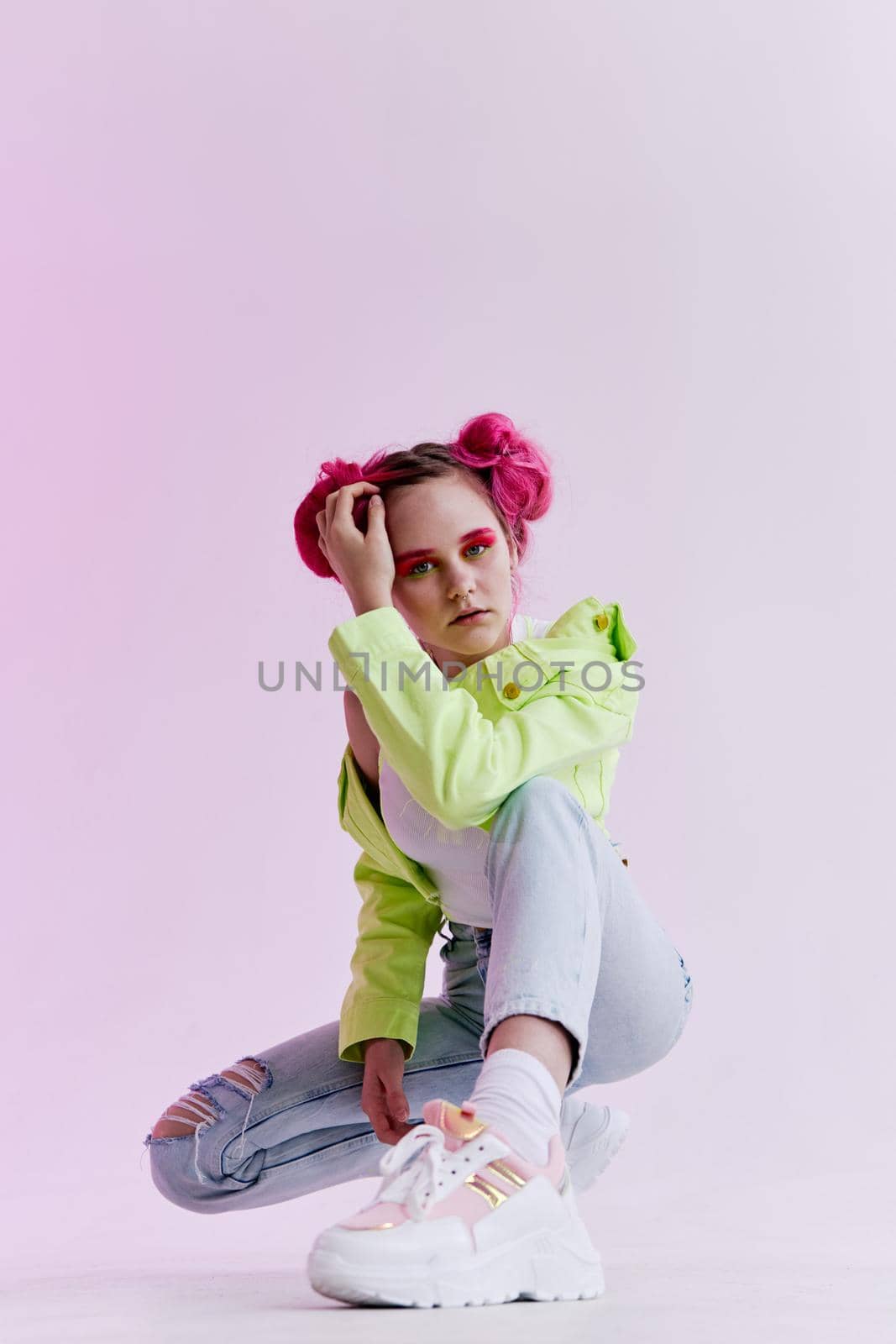 woman with pink hair teen fashionable clothes posing neon. High quality photo