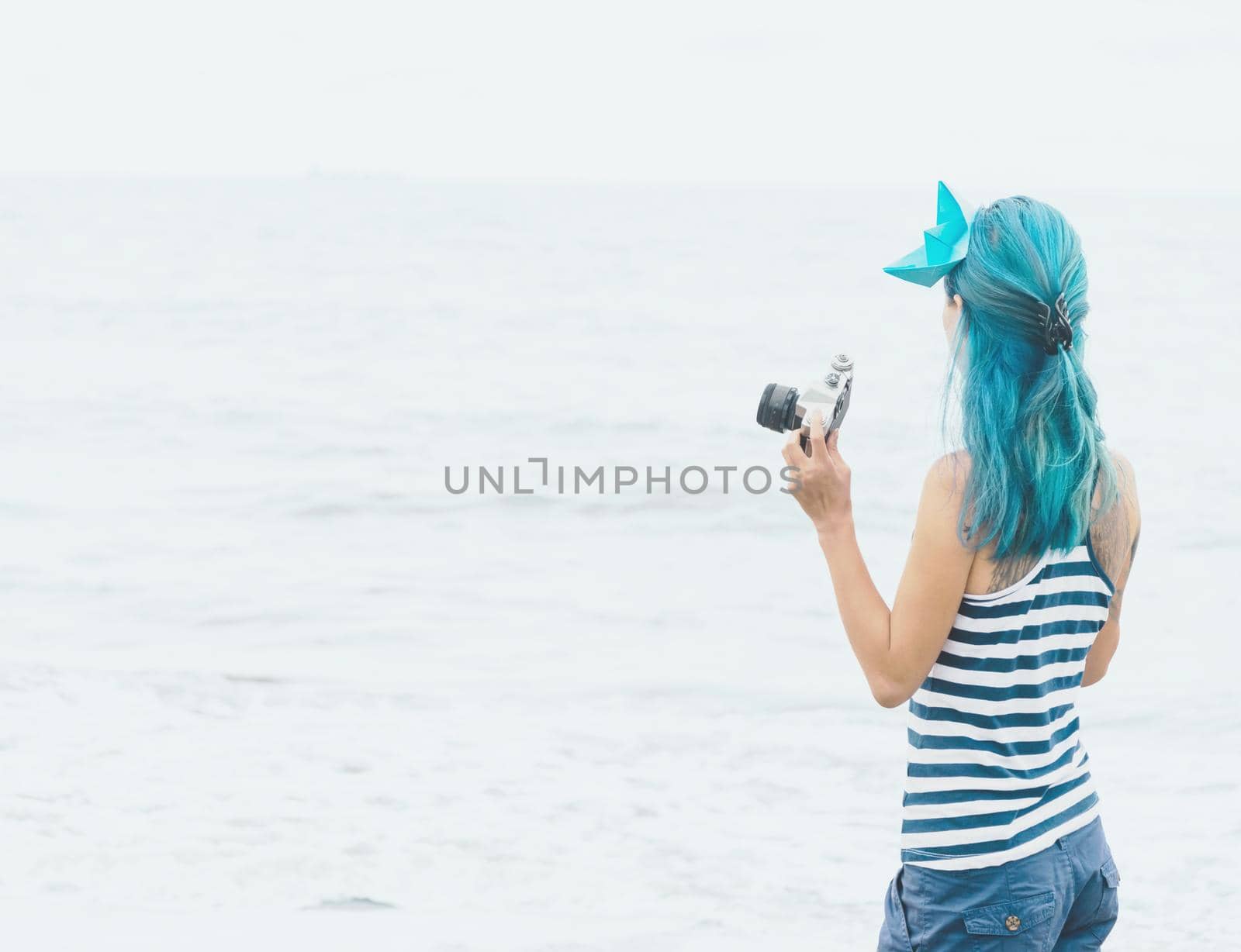 Female tourist looking at sea. by alexAleksei