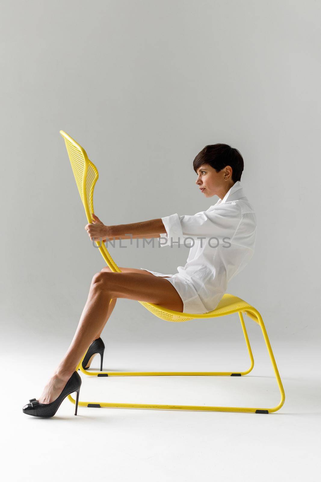 Trendy provocative model on modern chair by Demkat