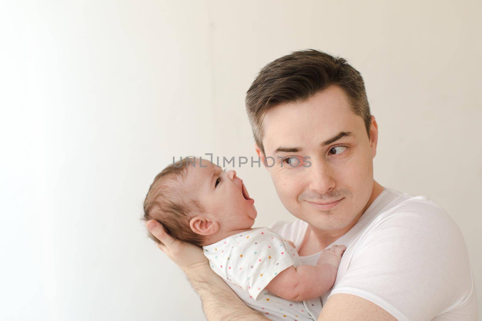 Cheerful man with screaming baby by Demkat