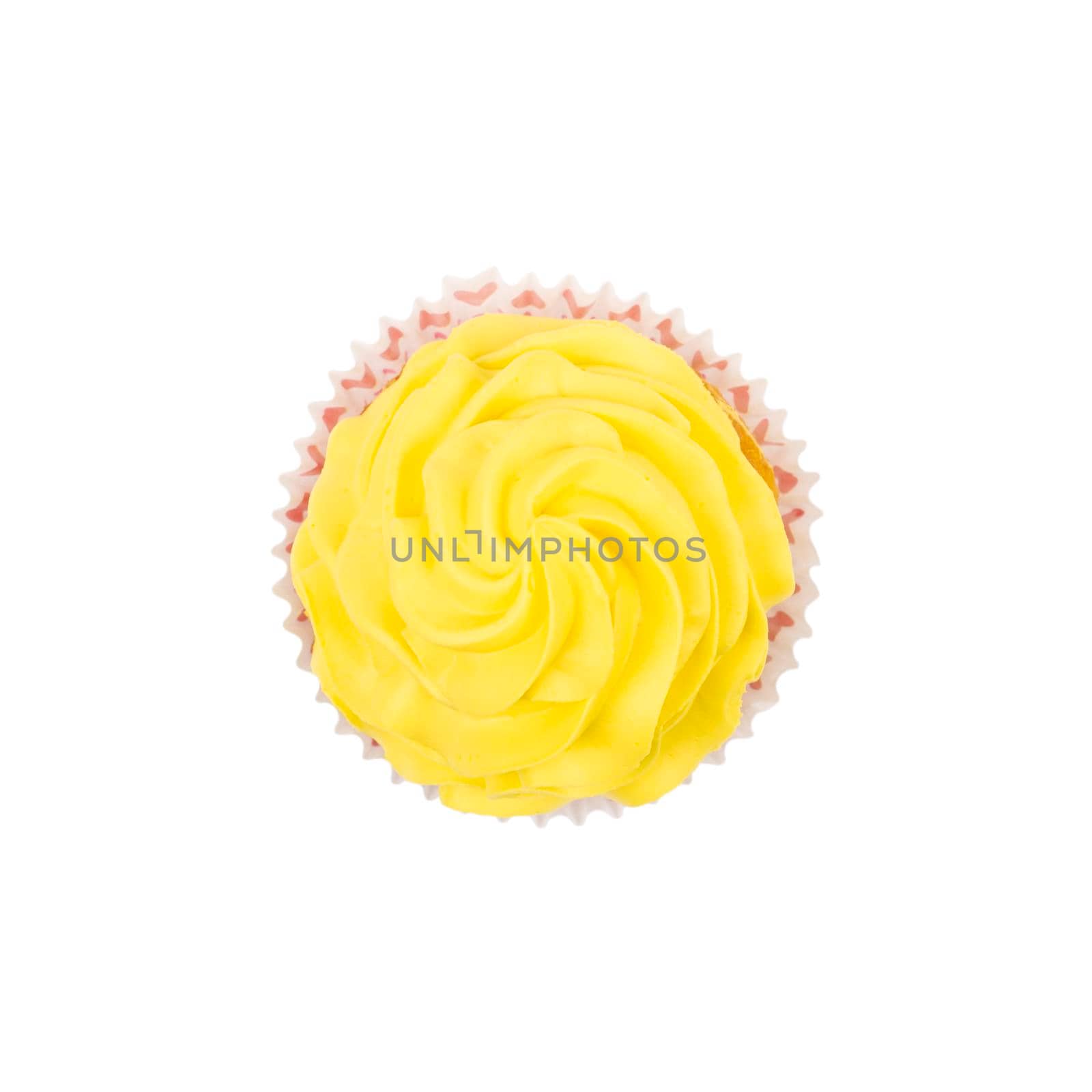 Cupcake with yellow butter cream frosting isolated on white background. Top view
