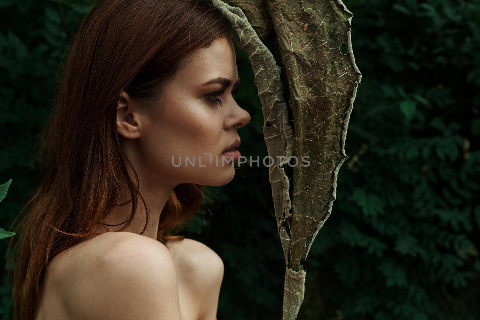 beautiful woman in a field outdoors bare shoulders clear skin cropped view by Vichizh