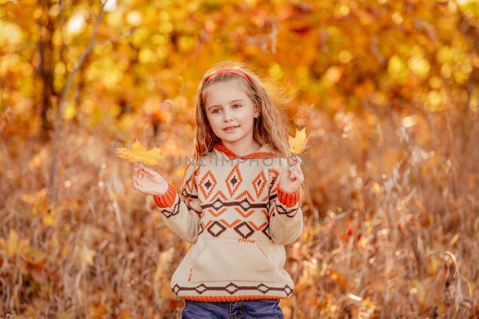 Cute girl holding yellow leaves by tan4ikk1