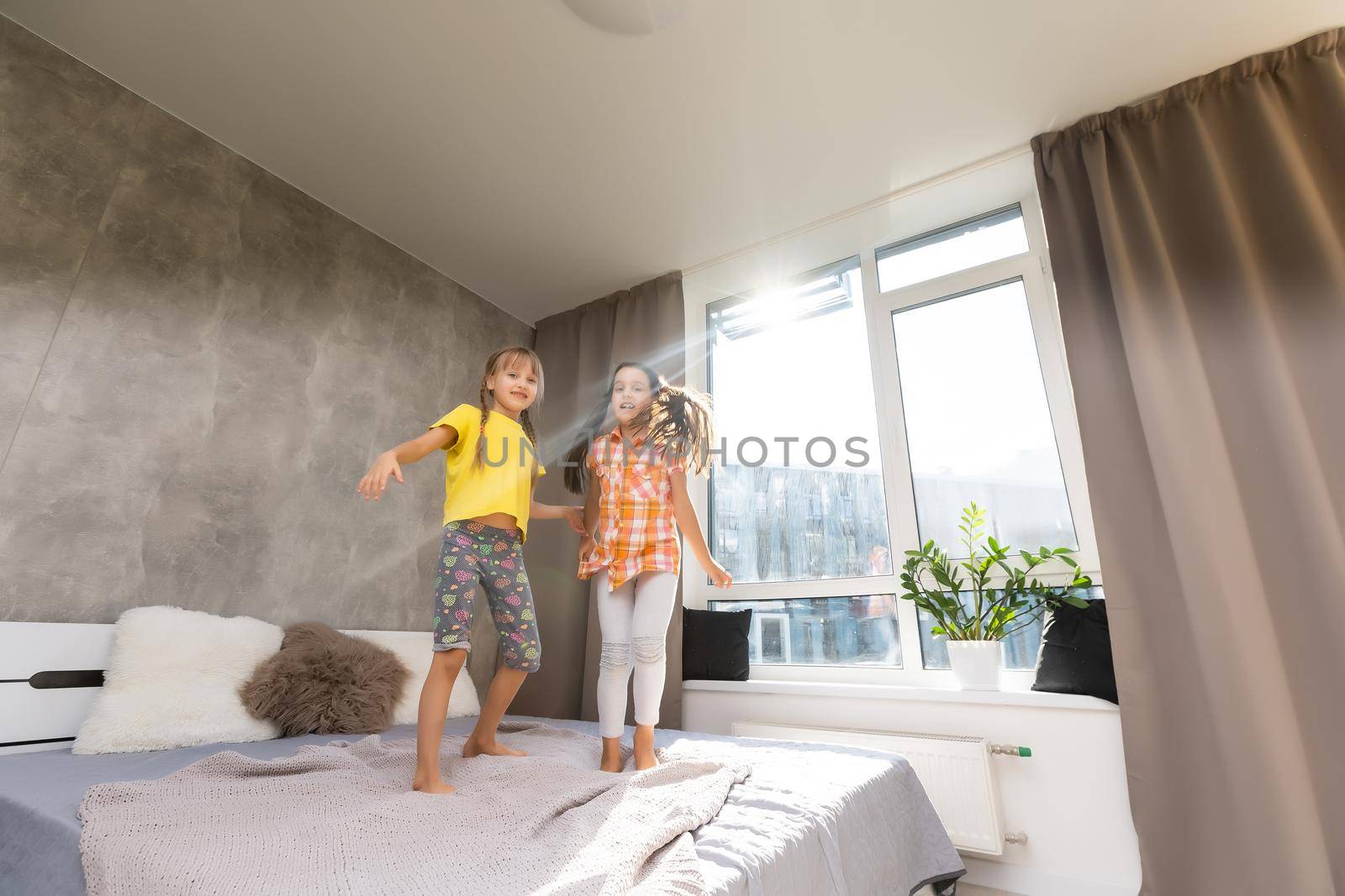 Creative cute girls, two sisters at home