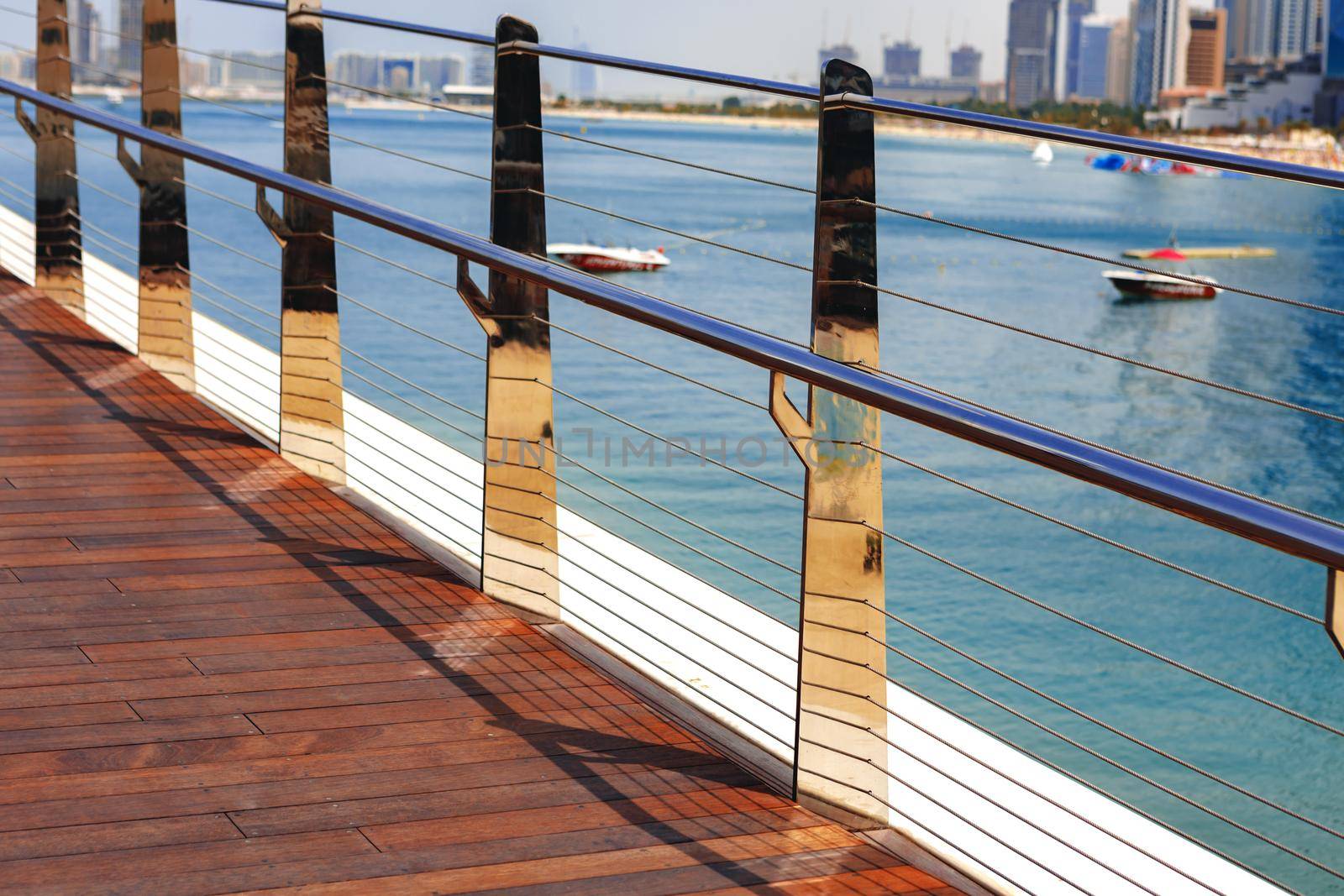 Pedestrian hanging bridge over sea in Dubai Marina, UAE