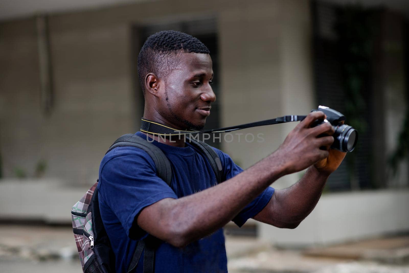 Young traveler or photographer doing tourism taking the picture of the cityscape. Photography and tourism concept