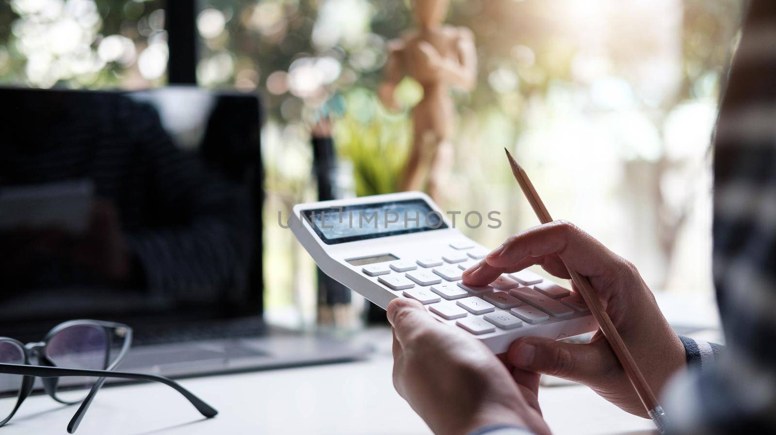 woman accountant or banker using calculator in retro office.