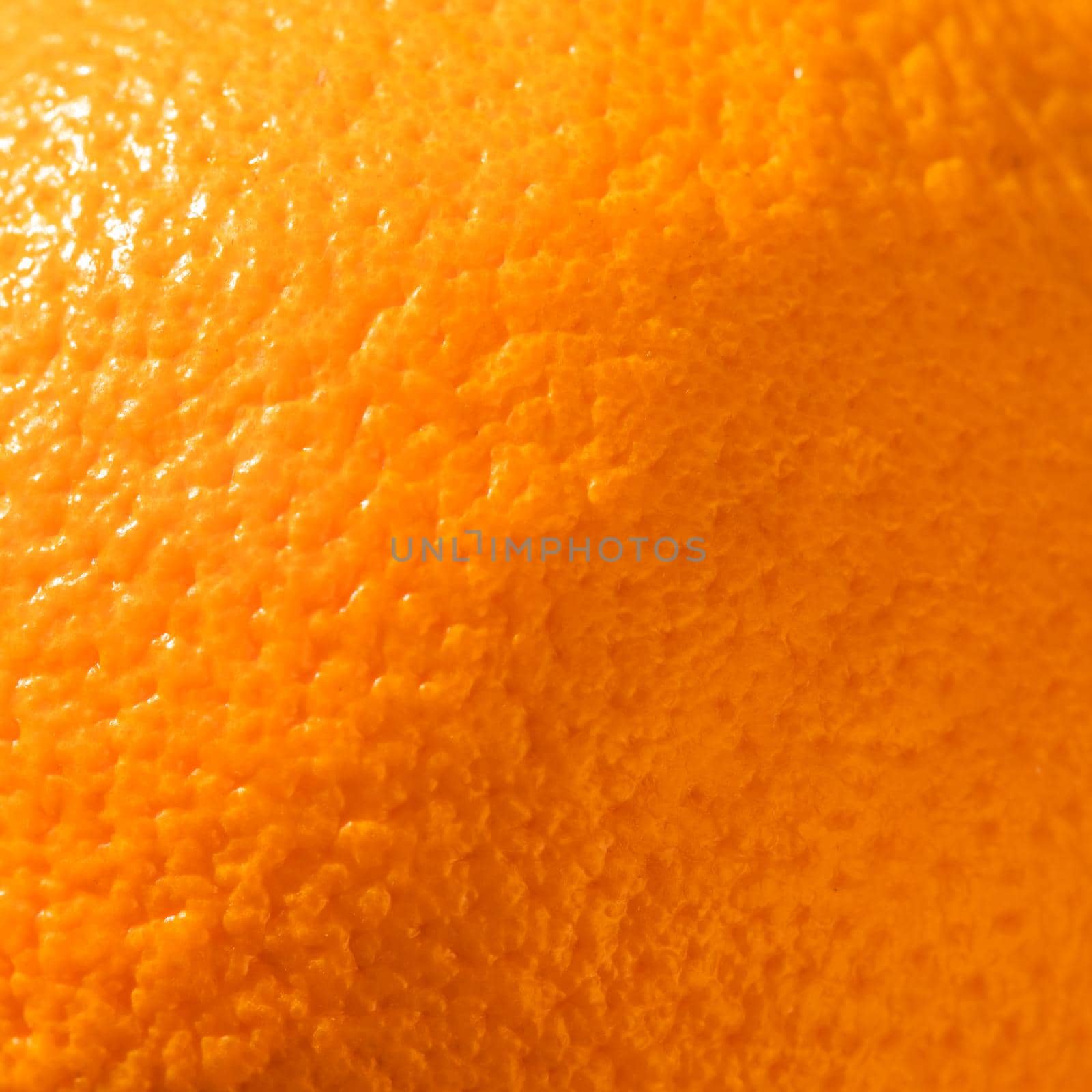 Ripe orange peel background. Close up view by Olayola