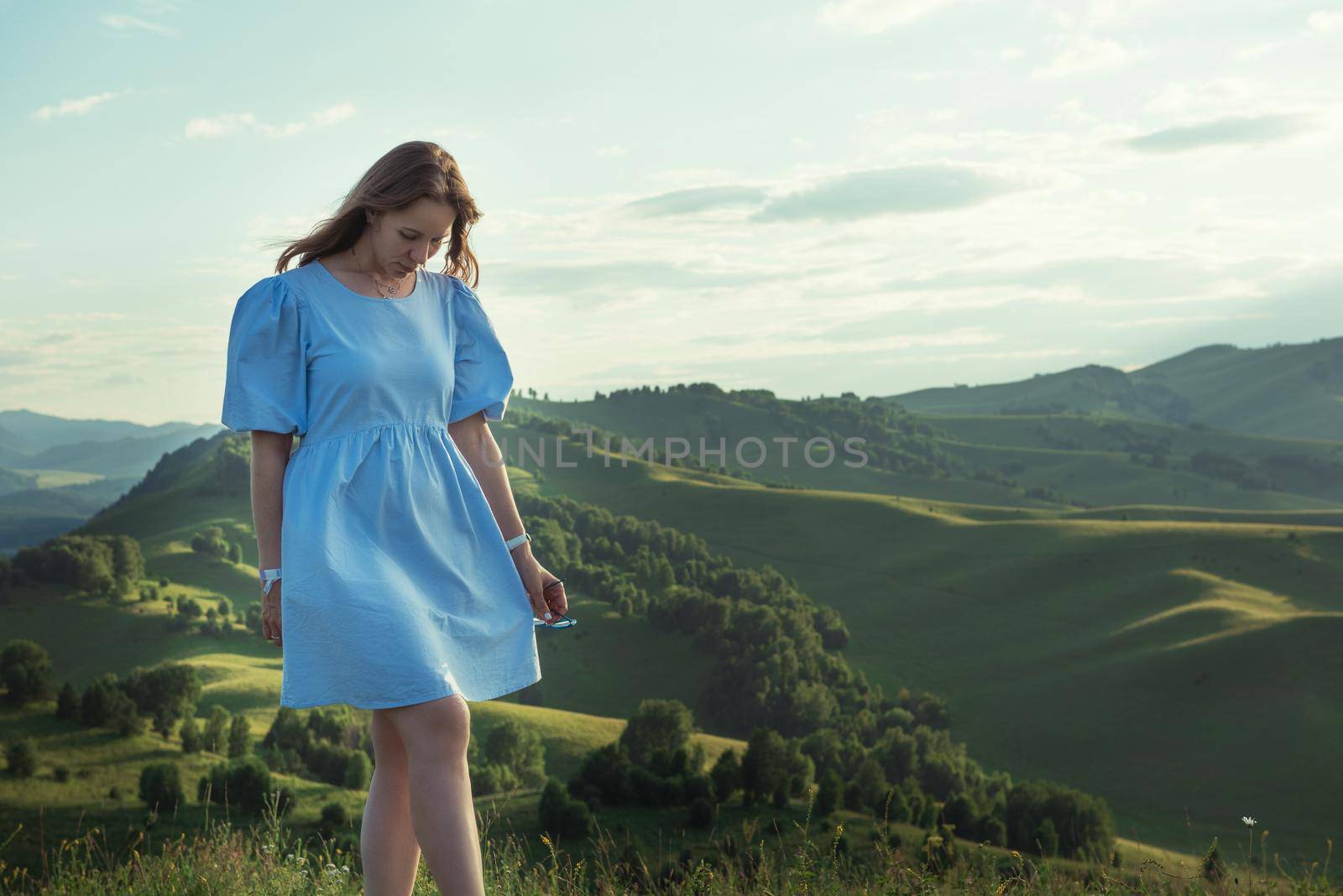 Woman in blue dress in Altai mountain, beauty summer landcape, travel, lesure concept/