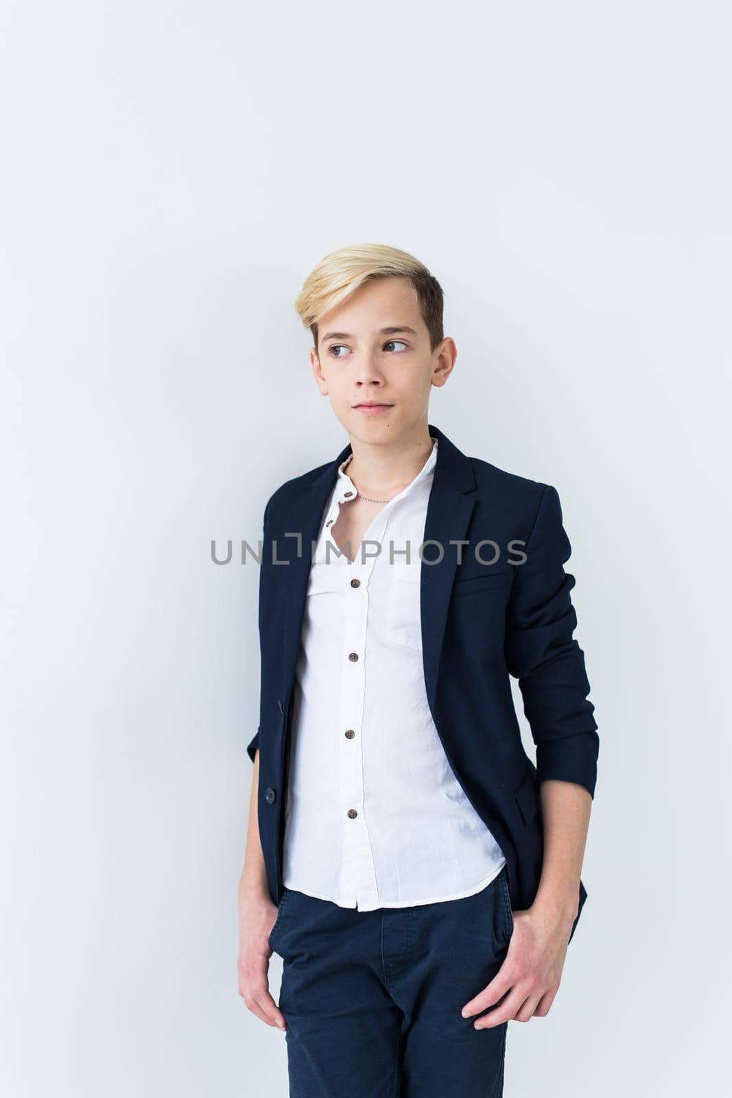 Teenage boy portrait on a white background.