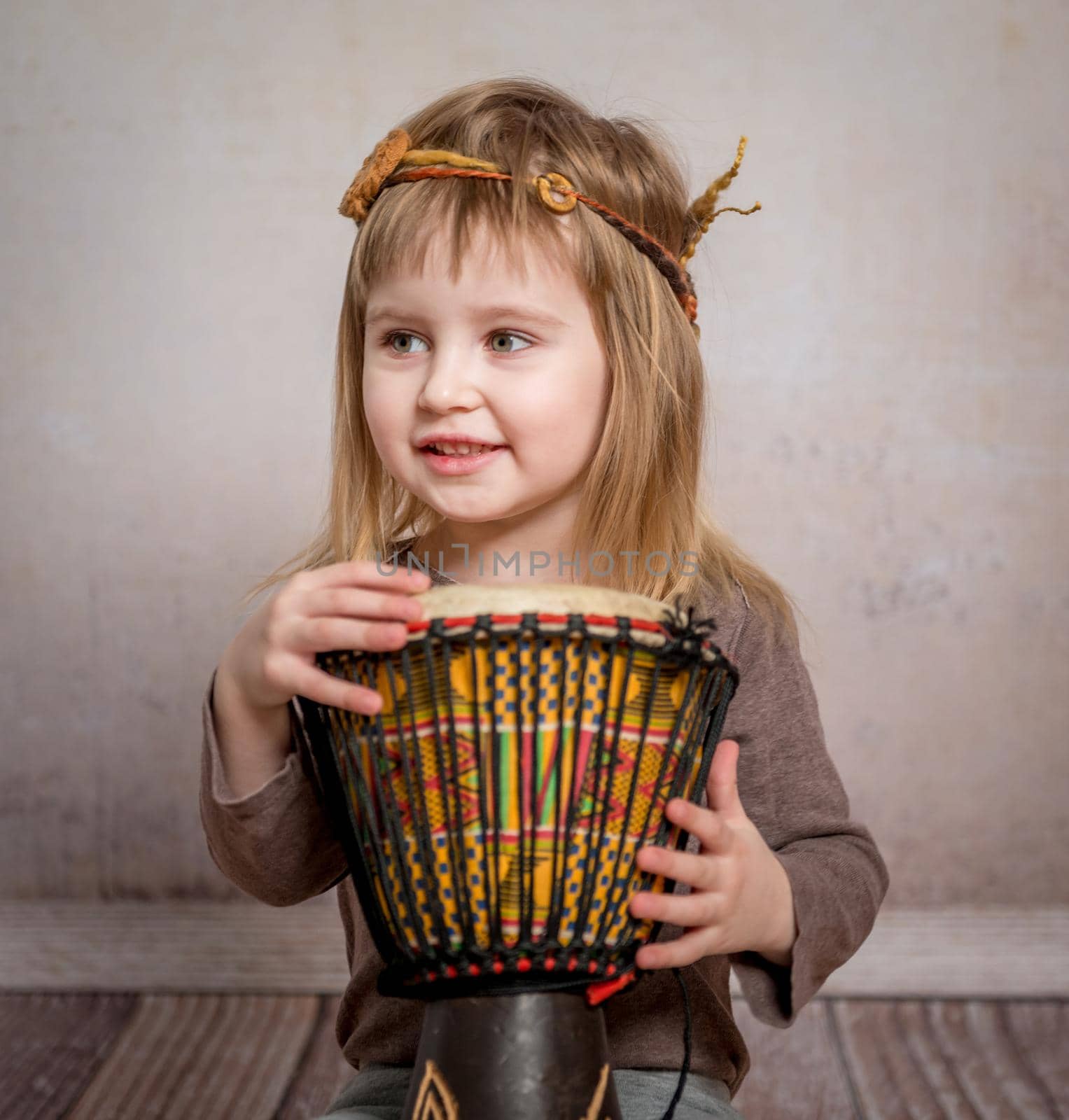 cute little girl playing drum by tan4ikk1