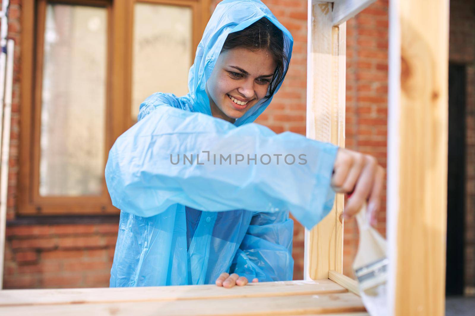 woman painter protective clothing wooden fittings renovation by Vichizh