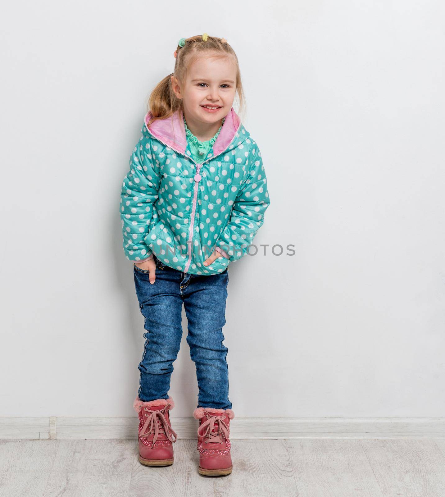 trendy little girl in jeans, jacket and boots by tan4ikk1