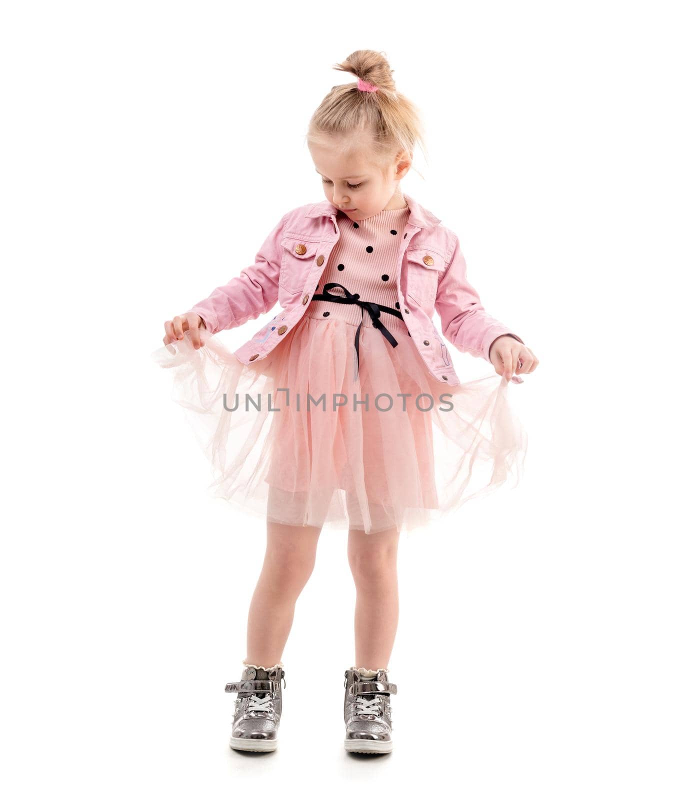 Cute girl holding her skirt, ready to dance by tan4ikk1