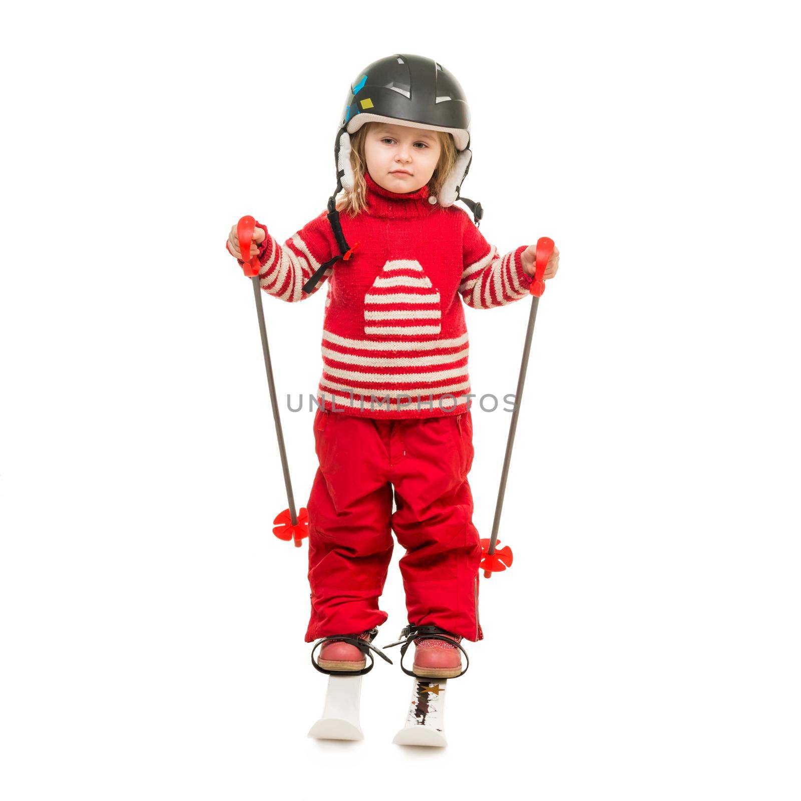 little girl in red ski suit standing on skis by tan4ikk1