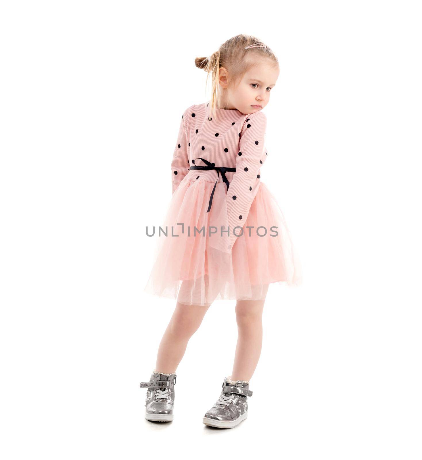Cute girl spinning around, wearning pink polkadot shirt and skirt, lovely shoes, isolated