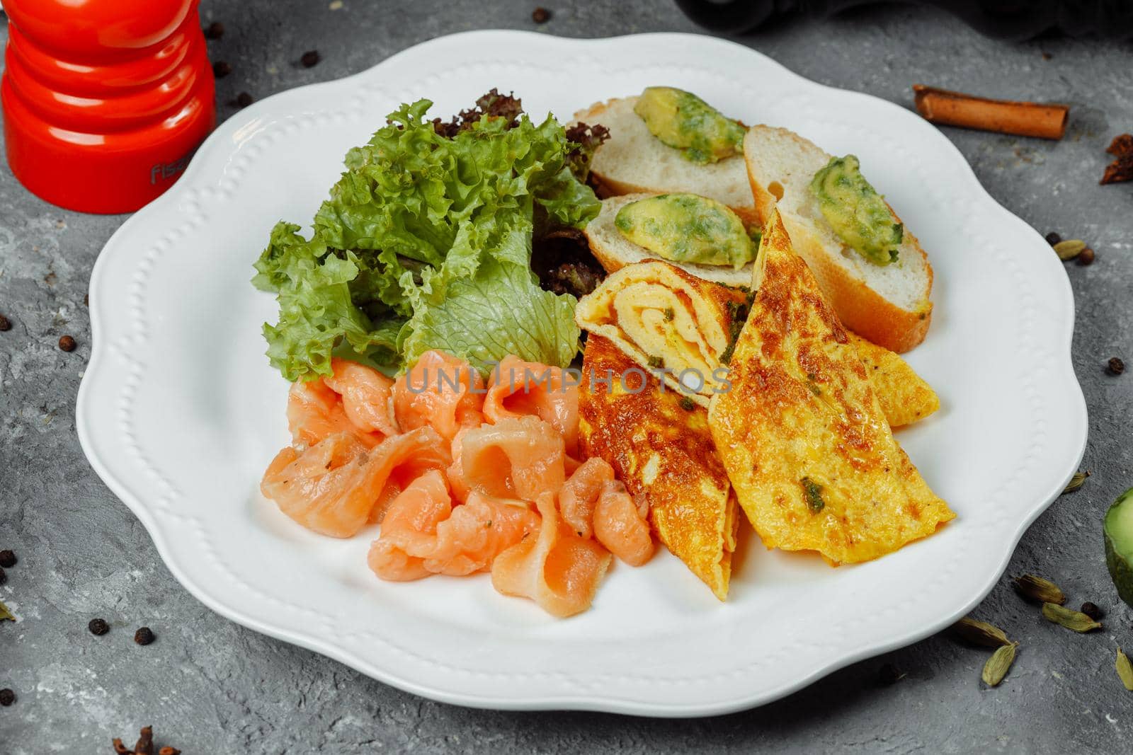 omelet with red fish and vegetables, beautiful serving.