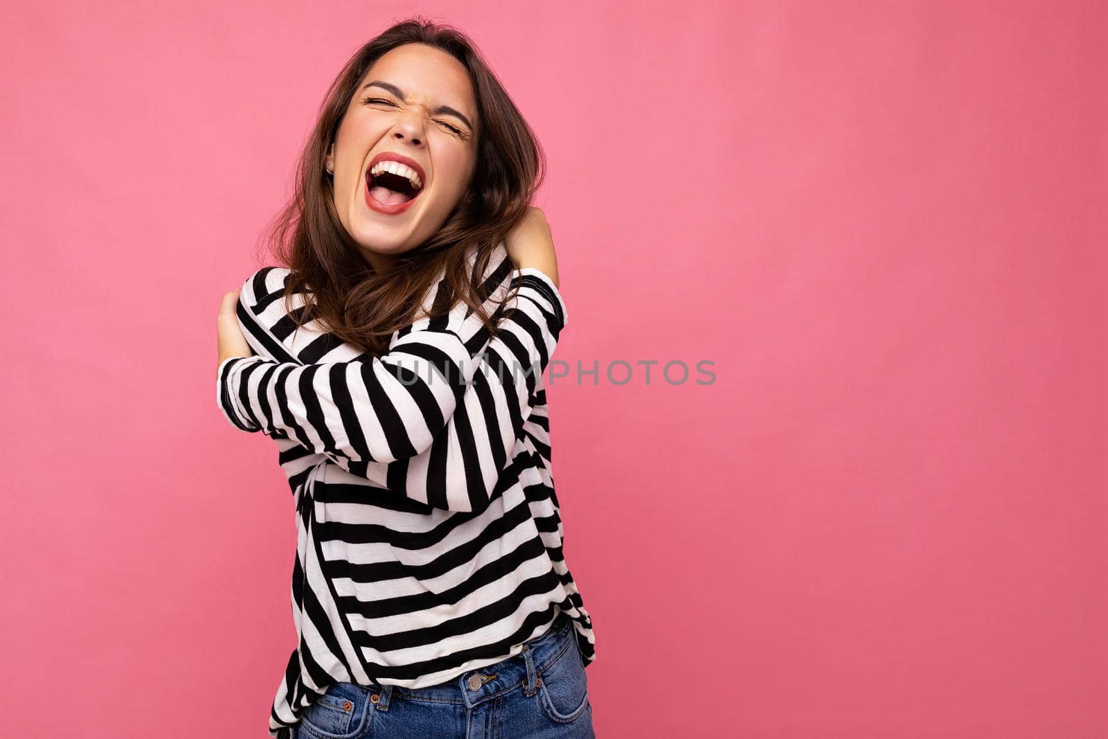 Photo shot of cute attractive pretty young emotional mad brunette woman wearing casual striped longsleeve isolated over colorful background with copy space and shouting by TRMK