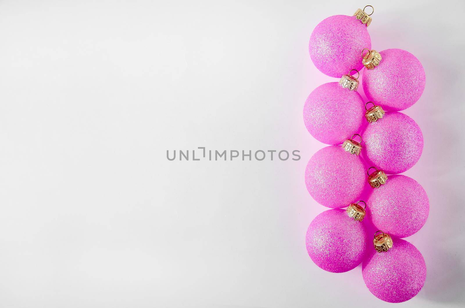 Christmas Pink Ball on Light Background. Minimal New Year Holiday Composition. Banner. Flat Lay. Copy Space.