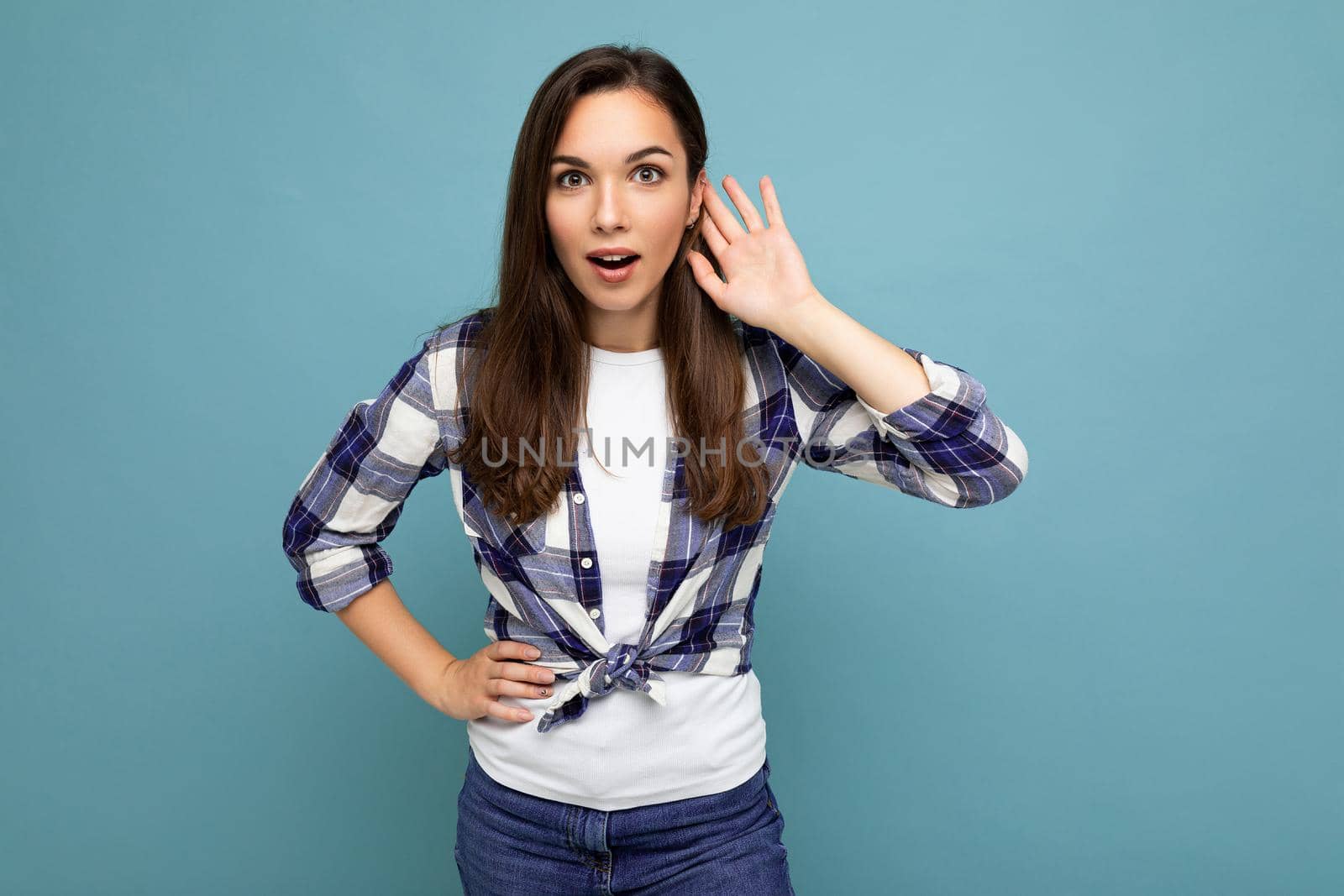 Closeup photo of beautiful attractive shocked amazed surprised young woman with open mouth wearing casual clothes isolated over colourful background with empty space.