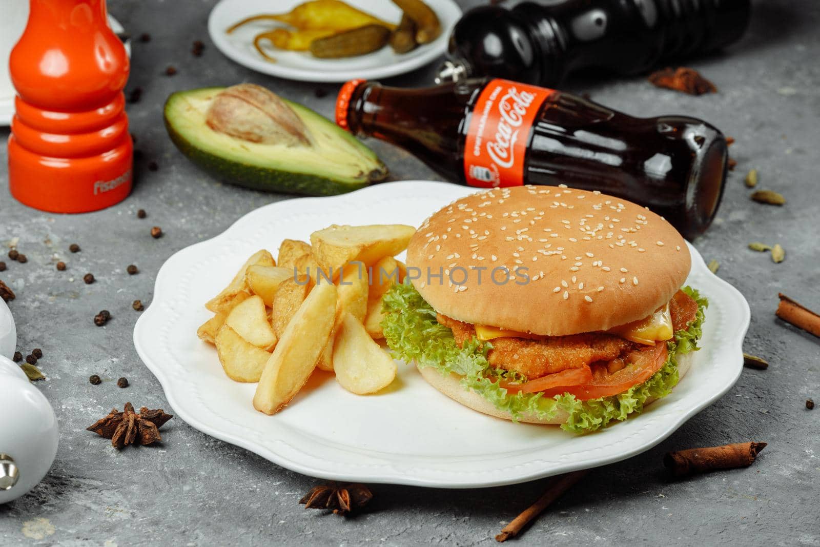 hamburger with fries and salad on the plate.