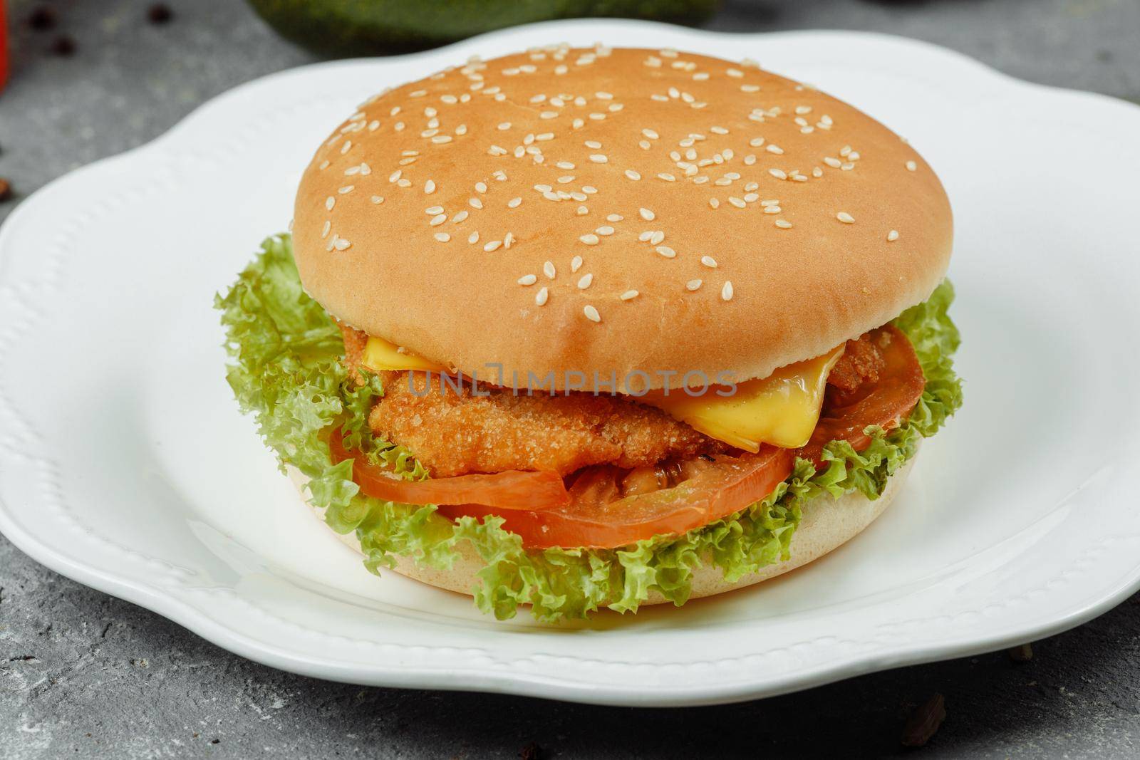 hamburger with fries and salad on the plate.