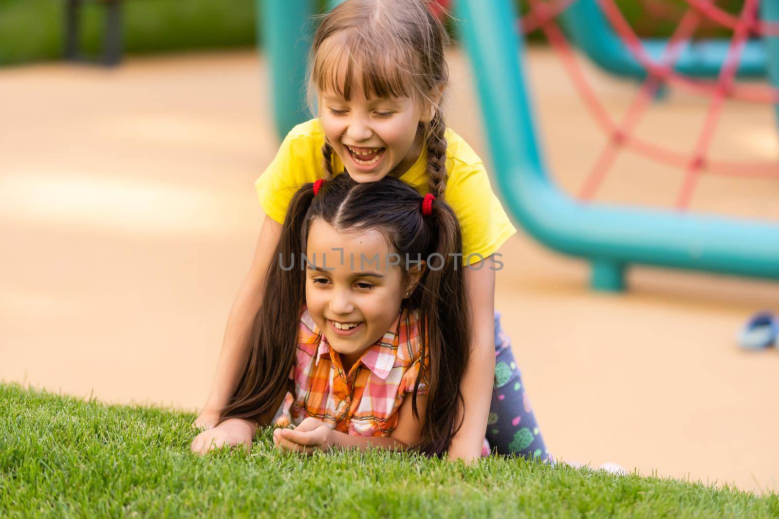happy excited kids having fun together on playground