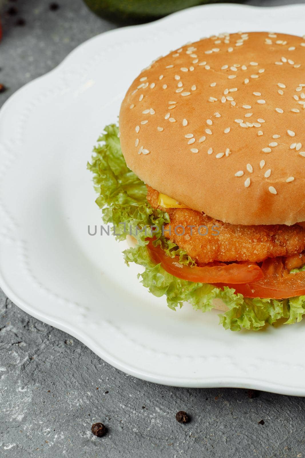 hamburger with fries and salad on the plate.