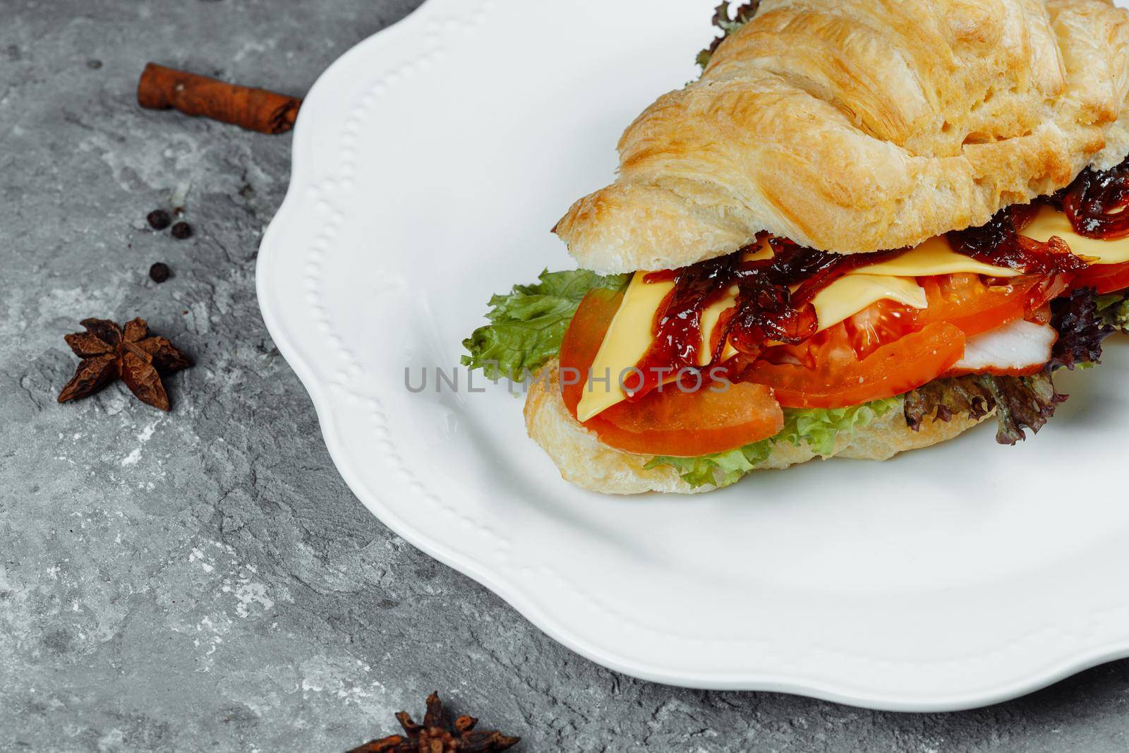 Delicious ham and cheddar cheese croissant with salad by UcheaD