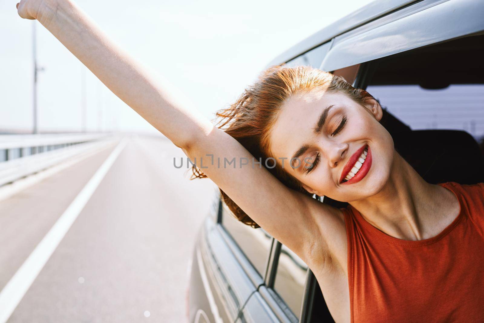 cheerful woman car ride road travel adventure. High quality photo