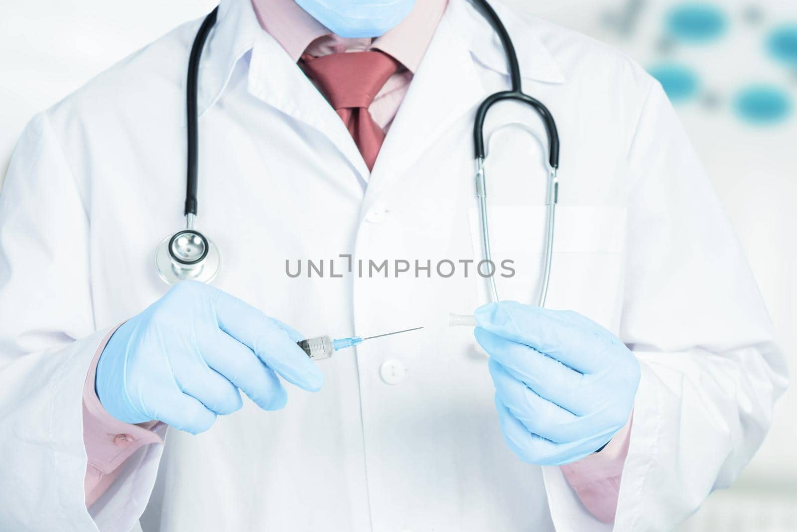 Doctor puts a cap on the syringe by alexAleksei