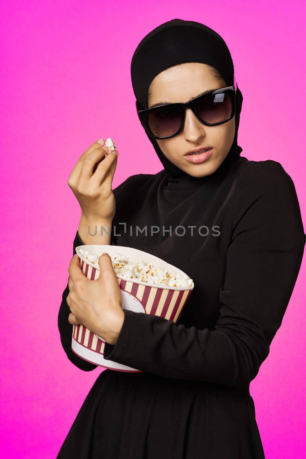 arab woman entertainment cinema popcorn fashion model ethnicity. High quality photo