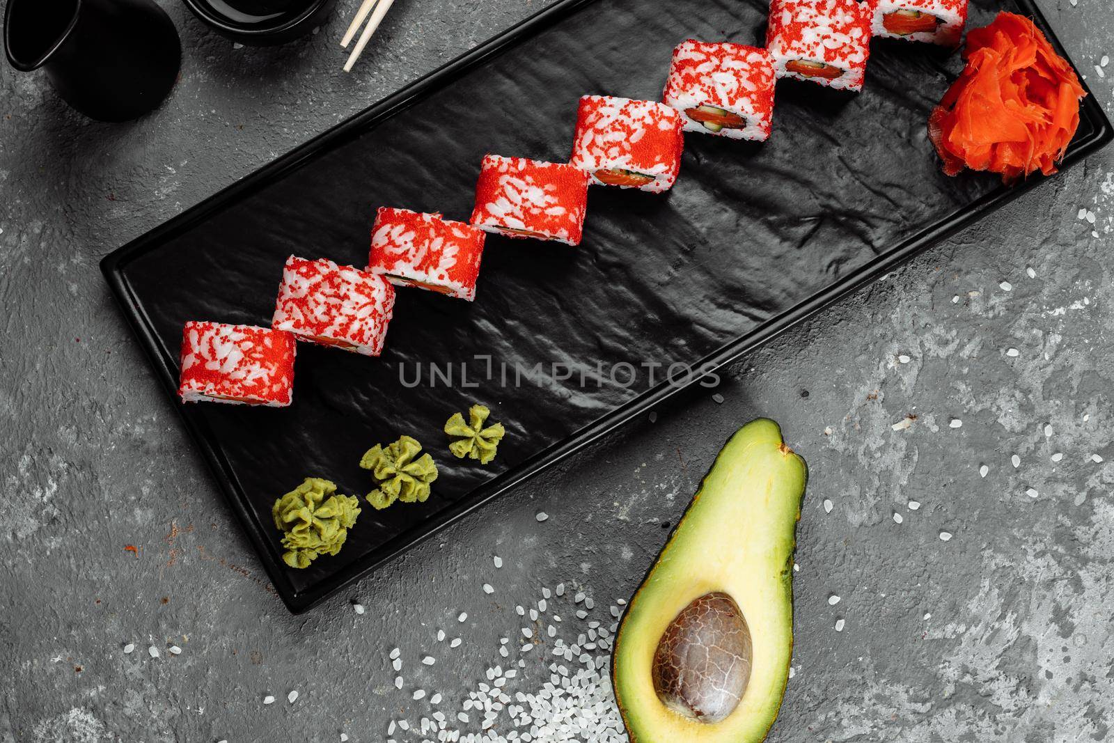 California sushi style rolls, with raw vegetables, food border background.