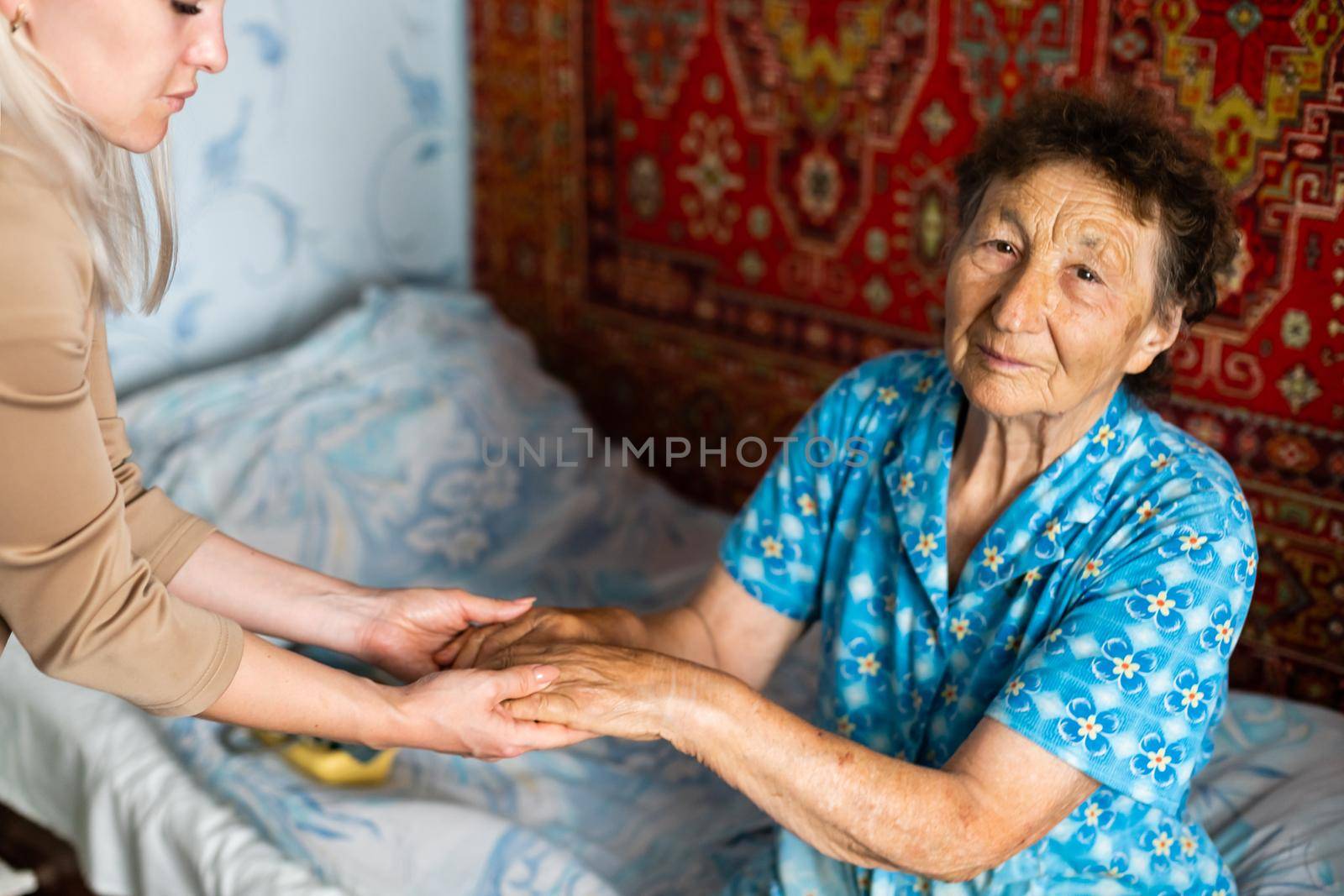 Senior woman with her home caregiver