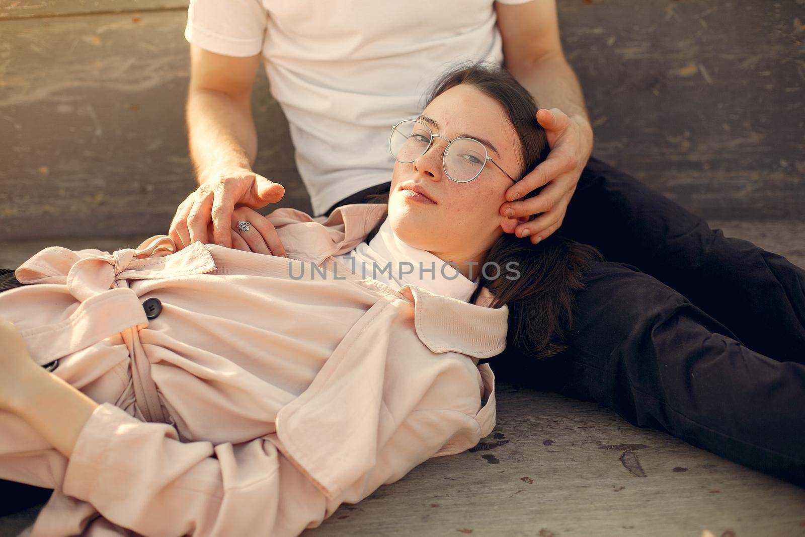 Couple in a summer park. Man in a white t-shirt.