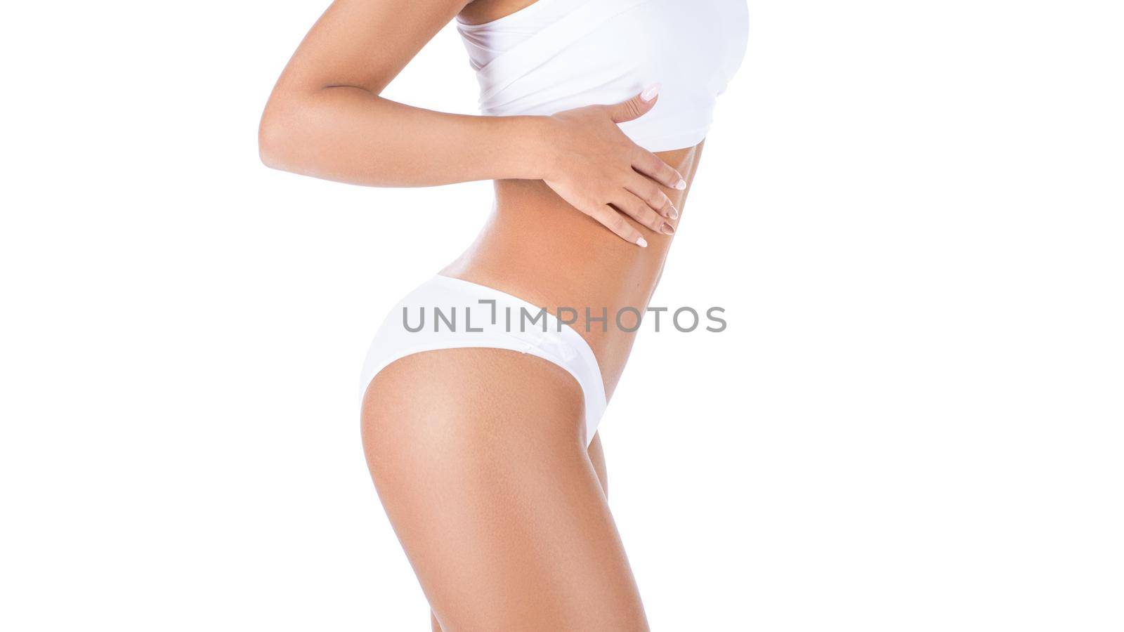 Woman showing her waist. Isolated over white background. by Stavros