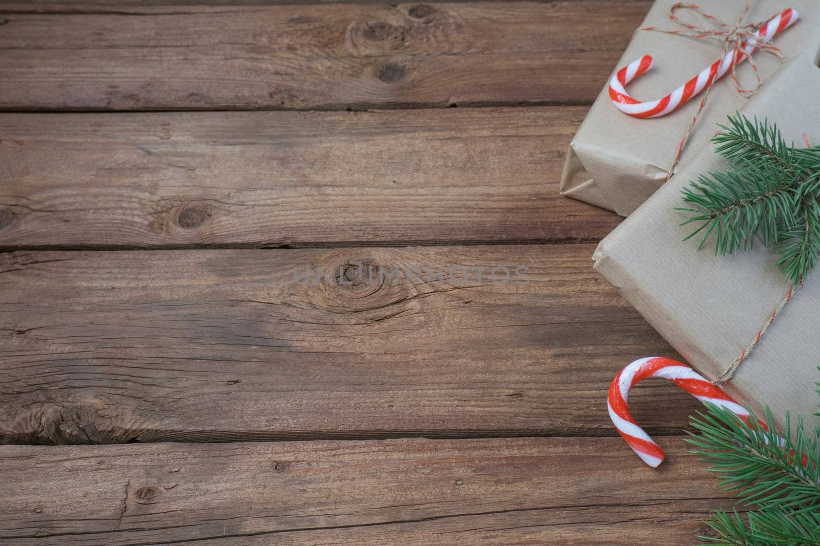 Christmas decoration and gift boxes on wooden background. Space for text by Ekaterina34